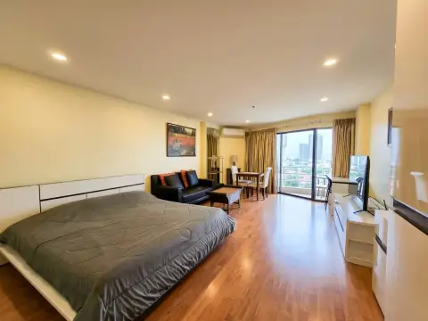 1 Bedroom Condo for Sale at View Talay 2 bedroom with king bed, sofa, dining table and balcony access