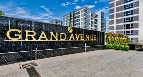 1 Bedroom Condo for Sale at Grand Avenue Residence entrance signage with gold lettering and building view