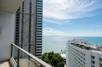 1 Bedroom Condo for Rent at Northpoint balcony with glass railing offering open sea and city tower views