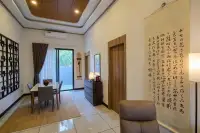 3 Bedroom House for Sale at Amarin House 2 dining area with marble-top table, lattice wall art, and large calligraphy scroll