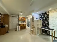 2 Bedroom Condo for Sale at Jomtien Beach Paradise open-plan living area with kitchenette and decorative accents