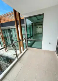2 Bedroom Condo for Sale at The Urban Pattaya private balcony with tiled flooring and glass railing