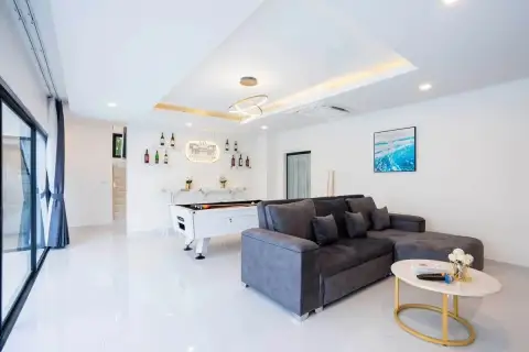 10 Bedroom House for Sale in Jomtien living room with pool table, gray sofa, and gold accent ceiling