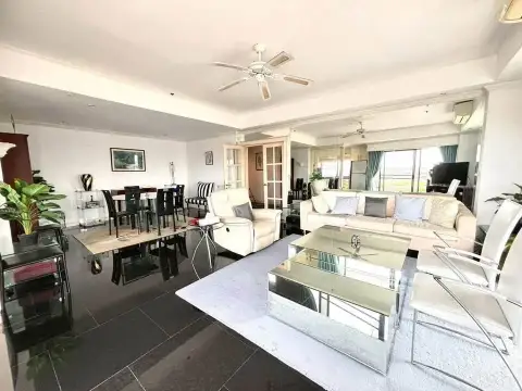 2 Bedroom Condo for Sale at Jomtien Beach Condominium combined living and dining area with mirrored decor