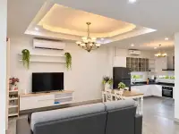 3 Bedroom House for Rent in Jomtien open-plan living room with TV unit, dining table and kitchen view