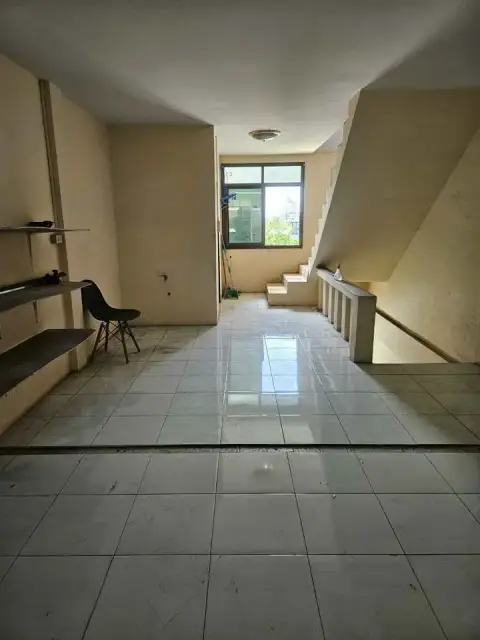 3 Bedroom House for Sale in Jomtien tiled entryway with staircase and natural light from window