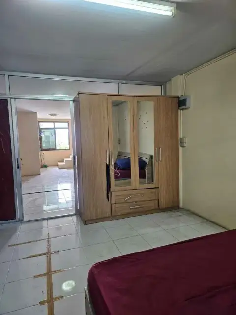 3 Bedroom House for Sale in Jomtien bedroom with wooden wardrobe and mirrored doors