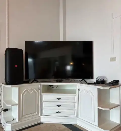 6 Bedroom House for Rent in Jomtien white entertainment cabinet with flat-screen TV and speaker