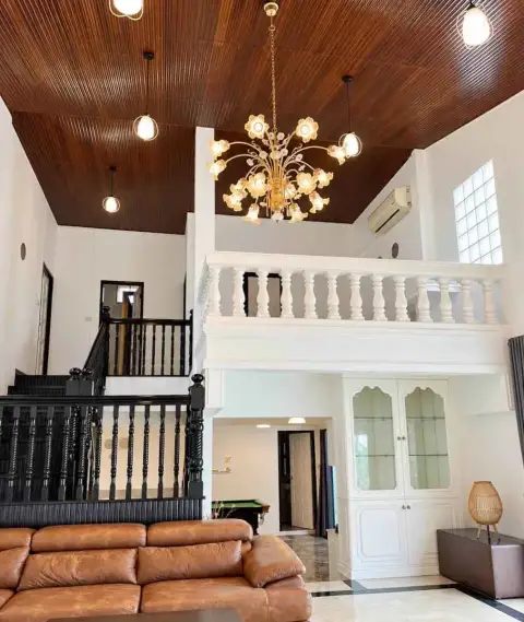6 Bedroom House for Rent in Jomtien double-height living room with chandelier and upstairs balcony