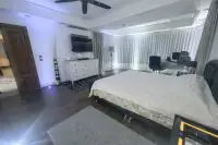 2 Bedroom Condo for Sale at Jomtien Plaza Condotel spacious master bedroom with king bed and workspace
