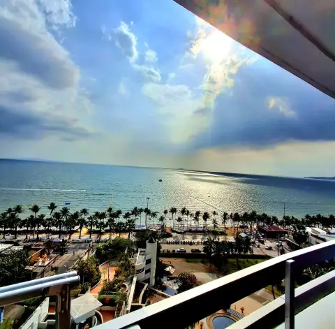 Studio Condo for Rent at Jomtien Plaza Condotel panoramic ocean view with palm-lined beach from balcony