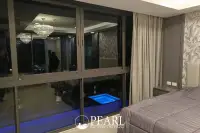 3 Bedroom Condo for Sale in Serenity Residence Jomtien communal swimming pool with sun loungers