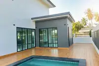 4 Bedroom House for Sale in Pong, rear view with wooden deck, swimming pool, and sliding glass doors.