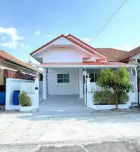 3 Bedroom House for Sale in East Pattaya white exterior facade with red tile roof and covered driveway