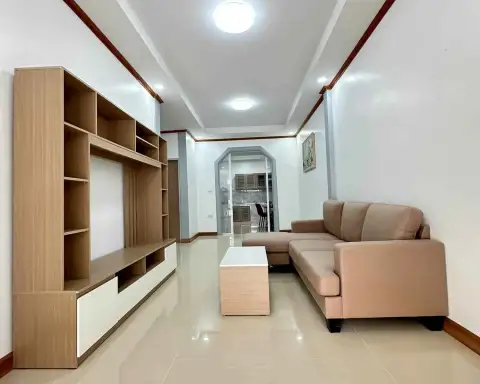 2 Bedroom Townhouse for Sale in East Pattaya hallway view of lounge with sofa and built-in shelving