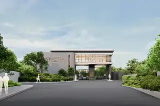 Spectra Residence main entrance gate front view with branded signage, security gatehouse and tree-lined driveway in Pattaya