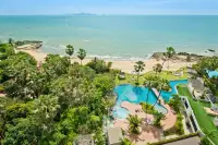 1 Bedroom Condo for Sale & Rent at Palm Wongamat aerial view of beachfront pool, tropical gardens and sea