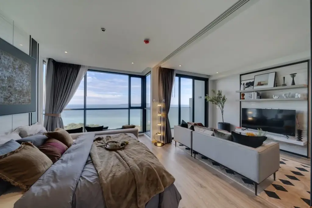 1 Bedroom Condo for Sale at Andromeda Condominium open-plan bedroom and living area with floor-to-ceiling sea view windows