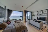 1 Bedroom Condo for Sale at Andromeda Condominium open-plan bedroom and living area with floor-to-ceiling sea view windows