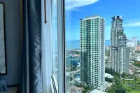 1 Bedroom Condo for Sale at The Twin Tower Jomtien Beach Pattaya high-floor window view of twin towers and Pattaya Bay coastline