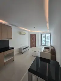 1 Bedroom Condo for Sale at Laguna Beach Resort 3 (The Maldives) open kitchen and lounge area with window balcony view
