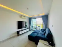 1 Bedroom Condo for Sale at Laguna Beach Resort 3 (The Maldives) living area with balcony access and pool view