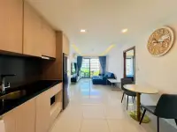 1 Bedroom Condo for Sale at Laguna Beach Resort 3 (The Maldives) open kitchen with dining nook and living room view