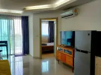 1 Bedroom Condo for Sale at Laguna Beach Resort 1 hallway view into bedroom with TV and wooden console