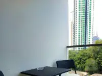 1 Bedroom Condo for Sale at Laguna Beach Resort 1 private balcony with seating and city skyline view