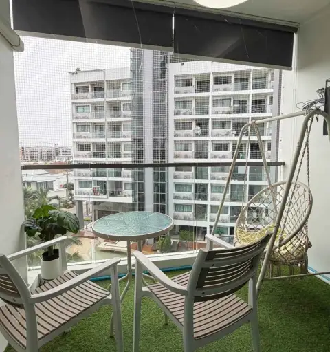 2 Bedroom Condo for Rent at Laguna Beach Resort 1 furnished balcony with hanging chair, table and city view