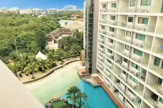 Laguna Beach Resort 1 aerial view of the resort's large pool area, artificial beach, and surrounding buildings.