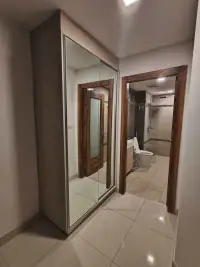 1 Bedroom Condo for Rent at Laguna Beach Resort 2 hallway with mirrored closet and bathroom with toilet and shower