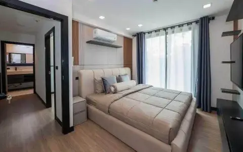 2 Bedroom Condo for Rent at Laguna Beach Resort 2 bedroom with upholstered bed, sheer curtains, and ensuite access