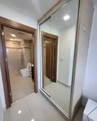 1 Bedroom Condo for Rent at Laguna Beach Resort 3 (The Maldives) hallway with mirrored sliding wardrobe and bathroom view