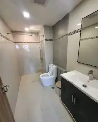 1 Bedroom Condo for Rent at Laguna Beach Resort 3 (The Maldives) bathroom with glass shower, toilet and vanity sink