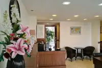 2 Bedroom Condo for Sale & Rent at Laguna Heights entryway with floral decor, seating area and world map artwork