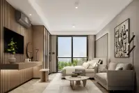 Studio Condo for Sale at Level Pratumnak living area with bed, sofa and balcony overlooking greenery