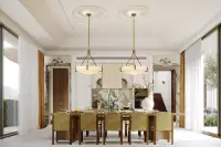 4 Bedroom House for Sale at Solava Pattaya elegant formal dining room with green velvet chairs, dual brass pendants and marble backsplash