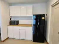 4 Bedroom House for Rent at Life in the Garden Rongpo - Motorway kitchenette with white cabinets, microwave and black refrigerator