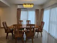 4 Bedroom House for Rent at Life in the Garden Rongpo - Motorway dining room with wooden table, chairs and crystal chandelier