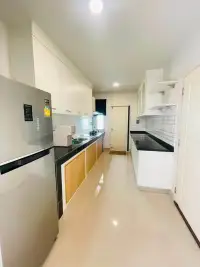 4 Bedroom House for Rent at Life in the Garden Rongpo - Motorway narrow kitchen with stainless fridge and black countertops