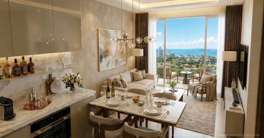 Studio Condo for Sale at Love It Wongamat Beach open-plan living and dining area with marble surfaces and sea view balcony