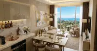 Studio Condo for Sale at Love It Wongamat Beach open-plan living and dining area with marble surfaces and sea view balcony