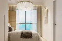 2 Bedroom Condo for Sale at Lucean Bay Jomtien Pattaya bedroom with sea view balcony and chandelier