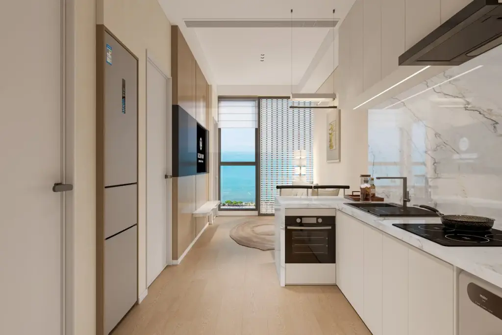 1 Bedroom Condo for Sale at Lucean Bay Jomtien Pattaya galley kitchen with marble island, oven, and sea view through floor-to-ceiling windows