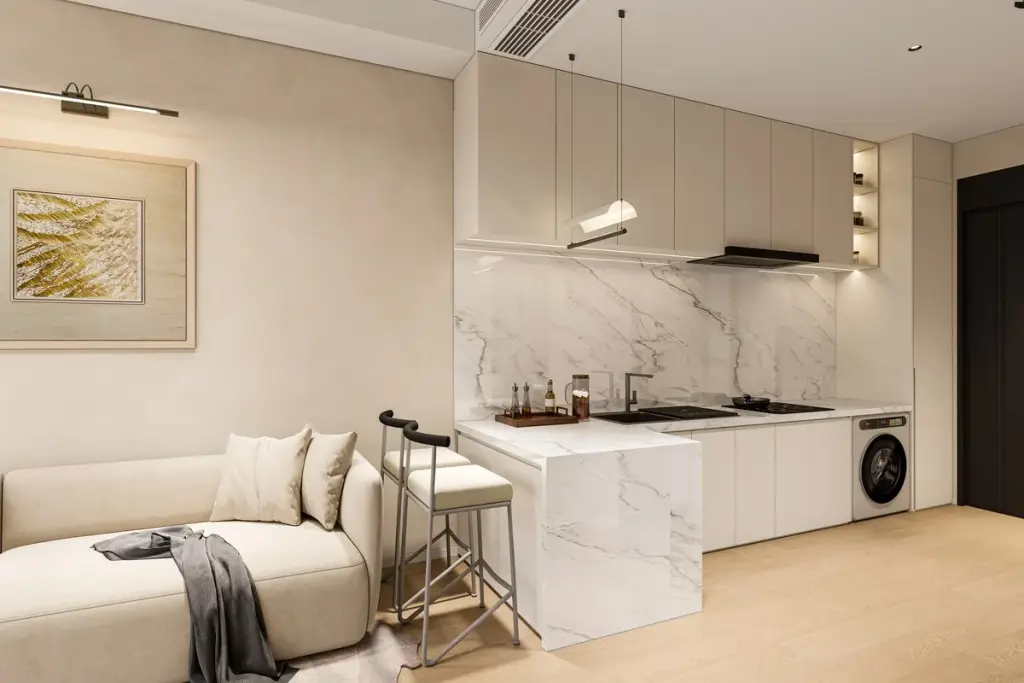2 Bedroom Condo for Sale at Lucean Bay Jomtien Pattaya open-plan living room with marble kitchen island and beige sofa