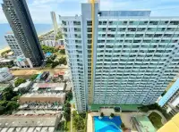 1 Bedroom Condo for Rent at Lumpini Park Beach Jomtien aerial view of tower with pool deck and ocean backdrop