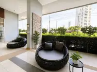 1 Bedroom Condo for Rent at Lumpini Park Beach Jomtien outdoor lounge area with round daybeds and city view