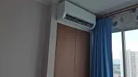 1 Bedroom Condo for Rent at Lumpini Ville Naklua-Wongamat bedroom air conditioning unit and wardrobe
