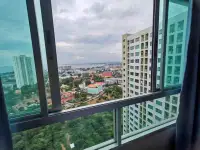 1 Bedroom Condo for Rent at Lumpini Ville Naklua-Wongamat high-rise window view of Pattaya city skyline and sea